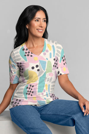 Whimsy Rose Domino Pastel Elbow Sleeve Tee.  Bright pink green yellow and blue abstract blocks and black dots on a white background.  V neck elbow sleeve a line tee.  Relaxed fit._34899418448072