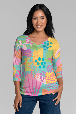 Whimsy Rose Riviera V Neck Top in Multi. Bright pastel mixed geometric pattern print. V neck 3/4 sleeve top with a burnout & sublimation effect. Classic fit._34899889389768