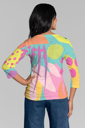 Whimsy Rose Riviera V Neck Top in Multi. Bright pastel mixed geometric pattern print. V neck 3/4 sleeve top with a burnout & sublimation effect. Classic fit._34899889357000