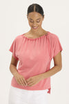 Wearables Exelda Tee in Retrograde a bright coral.  Boatneck with cinchable ribbon drawstring and toggle.  Dolman short sleeve.  High low hem.  Slightly boxy fit. _t_59448158257518