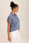 Wearables Abner Top in Hynotic Blue.  Pointed collar button down with short roll tab sleeves.  Raw edges.  Front patch pocket with raw edge trim.  Inset jersey side panels.  High low hem.  Relaxed fit._t_60009031106926
