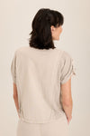 Wearables Abner Top in Ripple pigment.  Pointed collar button down with short roll tab sleeves.  Raw edges.  Front patch pocket with raw edge trim.  Inset jersey side panels.  High low hem.  Relaxed fit._t_60009031205230