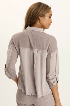 Wearables Knapp Twill Utility Snap Front Blouse in Foxglove.  Pointed collar snap front shirt.  3/4 sleeve with snap tab.  2 front zip breast pockets.  Back yoke in slub jersey.  Slub jersey insets at underarm.  Curved hem.  Fringed hem. Classic fit._61444814799214