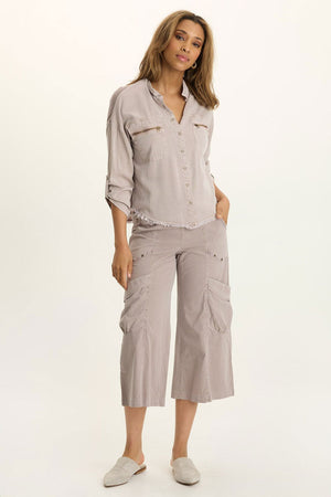 Wearables Knapp Twill Utility Snap Front Blouse in Foxglove.  Pointed collar snap front shirt.  3/4 sleeve with snap tab.  2 front zip breast pockets.  Back yoke in slub jersey.  Slub jersey insets at underarm.  Curved hem.  Fringed hem. Classic fit._61444814831982