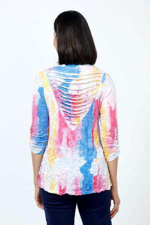 Top Ligne Watercolor Shredded Back Top in Multi. Bright streaks of blue, pink and yellow on a white background. V neck 3/4 sleeve top with 4 button trim at sleeve hem. V insert at back with shredded strips of fabric. Relaxed fit.._35222513549512