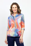 Top Ligne Color Swirls Snap Front Top in Multi.  Bright multi colored swirl print.  Pointed collar snap front top with double sets of turquoise covered snaps.  3/4 sleeve with lace detail and split cuff.  Relaxed fit._t_34981160911048
