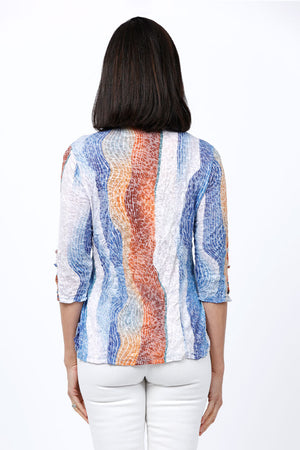 Top Ligne Color Waves Snap Front Shirt in Blue and white with rust accents. Vertical wave print. Pointed color snap front top with colored snaps. 3/4 sleeve with grommet and lace detail above slit cuff. Relaxed fit._34812274475208