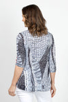 Top Ligne Ribbons Print shredded Back Top in Black & White. Ribbon blocks of black and white with mixed geometric patterns. V neck top with 3/4 sleeve. Contrast color snap detail on sleeves. V inset in back with shredded horizontal strips. Relaxed fit._t_34981310660808