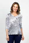 Top Ligne Squiggles Grommets Top in Black & White.  Op art squiggle print in black on a white background.  V neck 3/4 sleeve top with grommets and lace-up detail at left front hem.  Relaxed fit._t_35010878144712