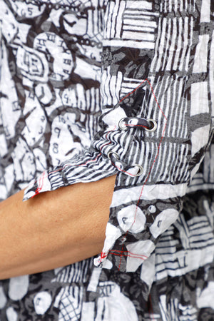 Top Ligne Whimsy Clocks Snap Front Shirt in Black/White.  Abstract mix of geometric prints and whimsical clock faces.  Pointed collar snap front shirt with pairs of red snaps.  3/4 sleeve with split cuff and lace-up detail.  Relaxed fit._61205457338734