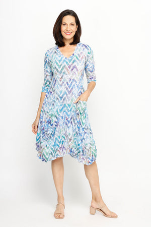 Top Ligne Chevron Pocket Dress in Multi.  Subtle pastel ombre chevron pattern.  V neck 3/4 sleeve crinkle dress.  Asymmetric seamed flounce hem.  2 front patch pockets.  Relaxed fit._61707650597230
