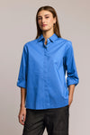 HInson Wu Xena Snap Front Blouse in Lake blue .  Pointed collar snap front blouse with covered  placket.   3/4 sleeve with split cuff.  Functional gold zipper up center back.  Relaxed fit._t_61472514212206