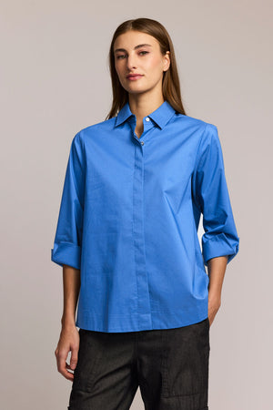 HInson Wu Xena Snap Front Blouse in Lake blue .  Pointed collar snap front blouse with covered  placket.   3/4 sleeve with split cuff.  Functional gold zipper up center back.  Relaxed fit._61472514212206