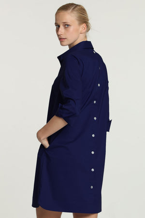 Hinson Wu Aileen Dress in Navy. Popover dress with 3 button placket. 3/4 sleeve with split button cuff. Buttons down center back. Relaxed fit._34981449597128
