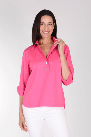 Hinson Wu Aileen Top in Magenta. Popover top with pointed open collar and 2 button placket. 3/4 sleeve with split turn back cuff. Buttons down back of blouse. High low hem. Relaxed fit._34386938855624