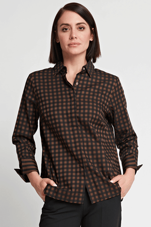 Hinson Wu Xena Check Zip Back Blouse in Caramel and Black check. Pointed collar button down with hidden button placket and single exposed gold button at neck. 3/4 sleeve with split turn back cuff lined in stripe. Functional gold zipper up center back unzips to reveal striped lining. Relaxed fit._34453065171144