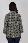 Hinson Wu Xena Geometric Zip Back Blouse in Black/Khaki. Pointed collar button down with hidden button placket and single gold exposed button at neck. 3/4 sleeves. Gold zipper up center back unzips to reveal a reverse color print lining. A line shape. Relaxed fit._t_34461017505992