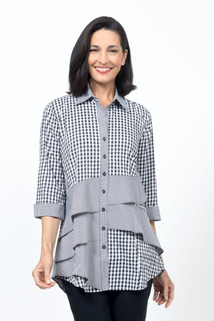 Cali Girls Jenna Mixed Check Blouse in Black/White.  Mixed check blouse with different size checks.  Pointed collar button down blouse with 3/4 sleeve and smaller check turn back cuff.  2 asymmetric front ruffles in small check.  Back yoke in small check.  Shirt tail hem.  Relaxed fit._34546711986376