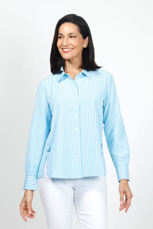 Cali Girls Checked Boyfriend Blouse in Light Blue/White. Pointed collar button down check blouse. Long sleeves with bias check button cuff. Side seams wrap to front. Front slits at seams with bias check button tab. Back yoke. Relaxed fit._35035602550984