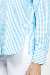 Cali Girls Checked Boyfriend Blouse in Light Blue/White. Pointed collar button down check blouse. Long sleeves with bias check button cuff. Side seams wrap to front. Front slits at seams with bias check button tab. Back yoke. Relaxed fit._t_35035602813128