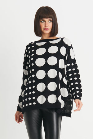 Planet Lots a Dots Sweater in Black with different size White polka dots in a geometric pattern.  Crew neck oversized sweater with long sleeves.  Drop shoulder.  Side slits.  Rib trim at neck, hem and cuff.  Oversized fit._34273276231880
