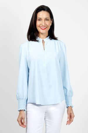 Beau Chemise Ruched Sleeve Popover in Sky.  Banded crew neck with ruffle trim.  Hidden 1/4 zipper front closure.  Long sleeves with smocked cuff.  Back yoke with soft gathers below.  Shirt tail hem.  Relaxed fit._35036162326728