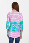 Whimsy Rose Pebble Walk Flowy Tunic in Multi. Bright color abstract geometric print on front. Back features complementary scribble print with front print detail. 3/4 sleeve with complementary print cuff. Shirt tail hem. Relaxed fit._t_35279736078536