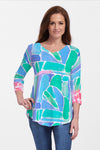 Whimsy Rose Pebble Walk Flowy Tunic in Multi.  Bright color abstract geometric print on front.  Back features complementary scribble print with front print detail.  3/4 sleeve with complementary print cuff.  Shirt tail hem.  Relaxed fit._t_35279736406216
