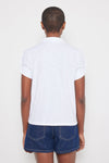 Lisa Todd Knot It Tee in White with bright yellow 1/4 zip front.  Pointed collar.  Short sleeve with knot detail. Relaxed fit._t_60257656996206