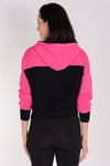 Planet Waffle Hoodie in Lipstick/Black. Two tone waffle pullover hoodie. Crew neck with attached hood and knit drawstring. Long sleeves with contrast color cuffs. Rib trim at cuff and hem. Cropped length. Oversized at shoulder and bust; cinched at hem.One size fits many._t_34329581813960