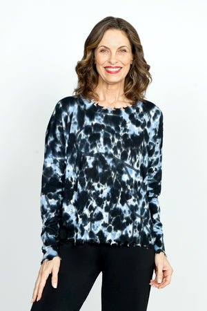 Planet Graffiti Sweater in Midnight. Light blue and white  splash prints with over printed midnight graffiti. Crew neck long sleeve sweater with notched sides. Drop shoulders. Rib trim at neck, hem and cuff. Distressed edges. One size fits many. Oversized fit._52933313429870