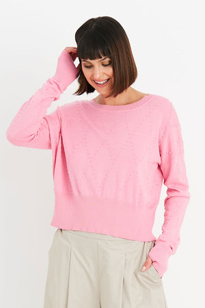 Planet Swiss Dot Sweater in Bubblegum pink.  Crew neck oversized crop sweater.  Drop shoulder.  Textural knit raised dots in a diamond pattern.  Rib trim at neck, hem and cuff.  Oversized fit._34818362474696