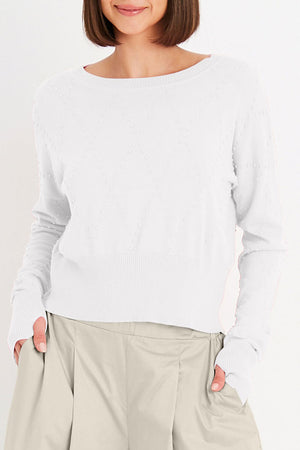 Planet Swiss Dot Sweater in White. Crew neck oversized crop sweater. Drop shoulder. Textural knit raised dots in a diamond pattern. Rib trim at neck, hem and cuff. Oversized fit._35312316874952
