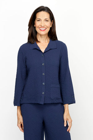 Habitat Crinkle Crepe Camp Shirt in Navy.  Spread collar button down.  Seams wrap to front with 3 button vertical tab detail at hem.  3/4 sleeve with vertical button tab.  Single front patch pocket.  Relaxed fit._61206315598190