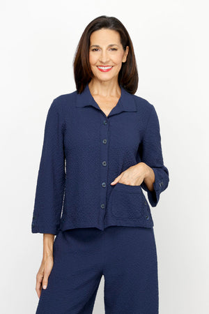 Habitat Crinkle Crepe Camp Shirt in Navy.  Spread collar button down.  Seams wrap to front with 3 button vertical tab detail at hem.  3/4 sleeve with vertical button tab.  Single front patch pocket.  Relaxed fit._61206315630958