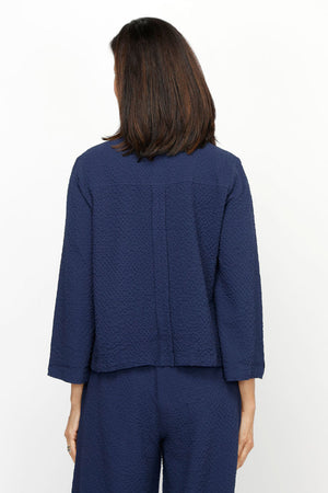 Habitat Crinkle Crepe Camp Shirt in Navy.  Spread collar button down.  Seams wrap to front with 3 button vertical tab detail at hem.  3/4 sleeve with vertical button tab.  Single front patch pocket.  Relaxed fit._61206315663726
