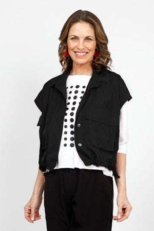 Planet Mini Cargo Vest in Black. Pointed collar button down cropped vest with covered button placket. 2 front lap large cargo pockets. Elastic cinching at hem. One size fits many._34953548071112