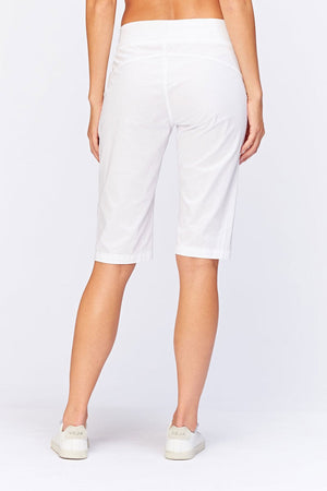 Wearables Tatem Bermuda in White. 2 1/2" elastic jersey waistband. Poplin body. Front center seams with ruch detail at sides. Curved back yoke. 10" rise in front; 15 1/2"in back. 14 1/2" inseam._34980809736392