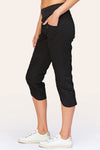 Wearables Iris Crop in Black.  2 1/2" jersey waistband with poplin body.  2 deep front pockets with grommet detail.  Center seams and contour seams.  Ruched detail front and back.  Front tulip hem.  22" inseam._t_61270052864366
