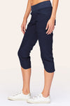 Wearables Iris Crop in Navy.  2 1/2" jersey waistband with poplin body.  2 deep front pockets with grommet detail.  Center seams and contour seams.  Ruched detail front and back.  Front tulip hem.  22" inseam._t_61270052962670