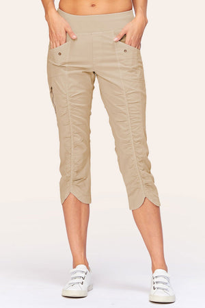 Wearables Iris Crop in Sand.  2 1/2" jersey waistband with poplin body.  2 deep front pockets with grommet detail.  Center seams and contour seams.  Ruched detail front and back.  Front tulip hem.  22" inseam._61270053028206