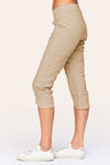 Wearables Iris Crop in Sand.  2 1/2" jersey waistband with poplin body.  2 deep front pockets with grommet detail.  Center seams and contour seams.  Ruched detail front and back.  Front tulip hem.  22" inseam._t_61270053060974