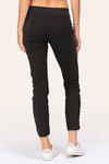 Wearables Malanda Pant in Black.  Pull on pant with 2 1/2" jersey elastic waistband.  Poplin body.  2 front slash pockets.  1 single zip front pocket.  Contour seams.  Ruched detail on front leg.  Jersey insets at side.  28" inseam. _t_61269626356078