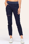 Wearables Malanda Pant in Navy.  Pull on pant with 2 1/2" jersey elastic waistband.  Poplin body.  2 front slash pockets.  1 single zip front pocket.  Contour seams.  Ruched detail on front leg.  Jersey insets at side.  28" inseam. _t_61269626487150