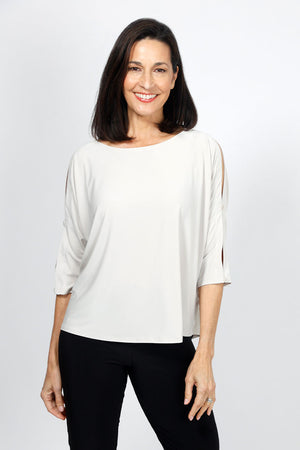 Sympli Convoy Top in Cashew. Boat neck relaxed top with elbow length slit sleeve. Functional buttons on sleeve. Slightly tapered to hem._35033450905800