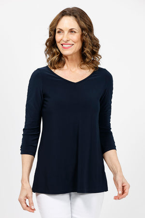 Sympli Revelry Ruched Sleeve Top in Navy. V neck 3/4 sleeve with ruched detail down center sleeve. Side slits. A line shape. Relaxed fit._35242310762696