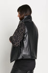 Planet Vegan Leather Padded Vest in Black. Microfiber stand collar. Cross over single button closure. Pointed front hem. One size fits many._t_35932251324616
