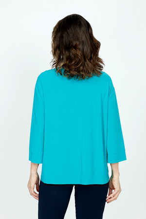 Sympli Splice Double Cuff Top in Gem, a bright jade.  Crew neck top with center seam and banded bottom.  3/4 sleeve with double cuff.  Raw edges.  Relaxed fit._59519405097326