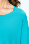 Sympli Splice Double Cuff Top in Gem, a bright jade.  Crew neck top with center seam and banded bottom.  3/4 sleeve with double cuff.  Raw edges.  Relaxed fit._t_59519405064558