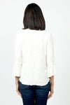 Sno Skins Dream V Neck Top in White. Textured swirl tone on tone print. V neck top with 3/4 bell sleeve. Curved hem. Relaxed fit._t_34622208737480